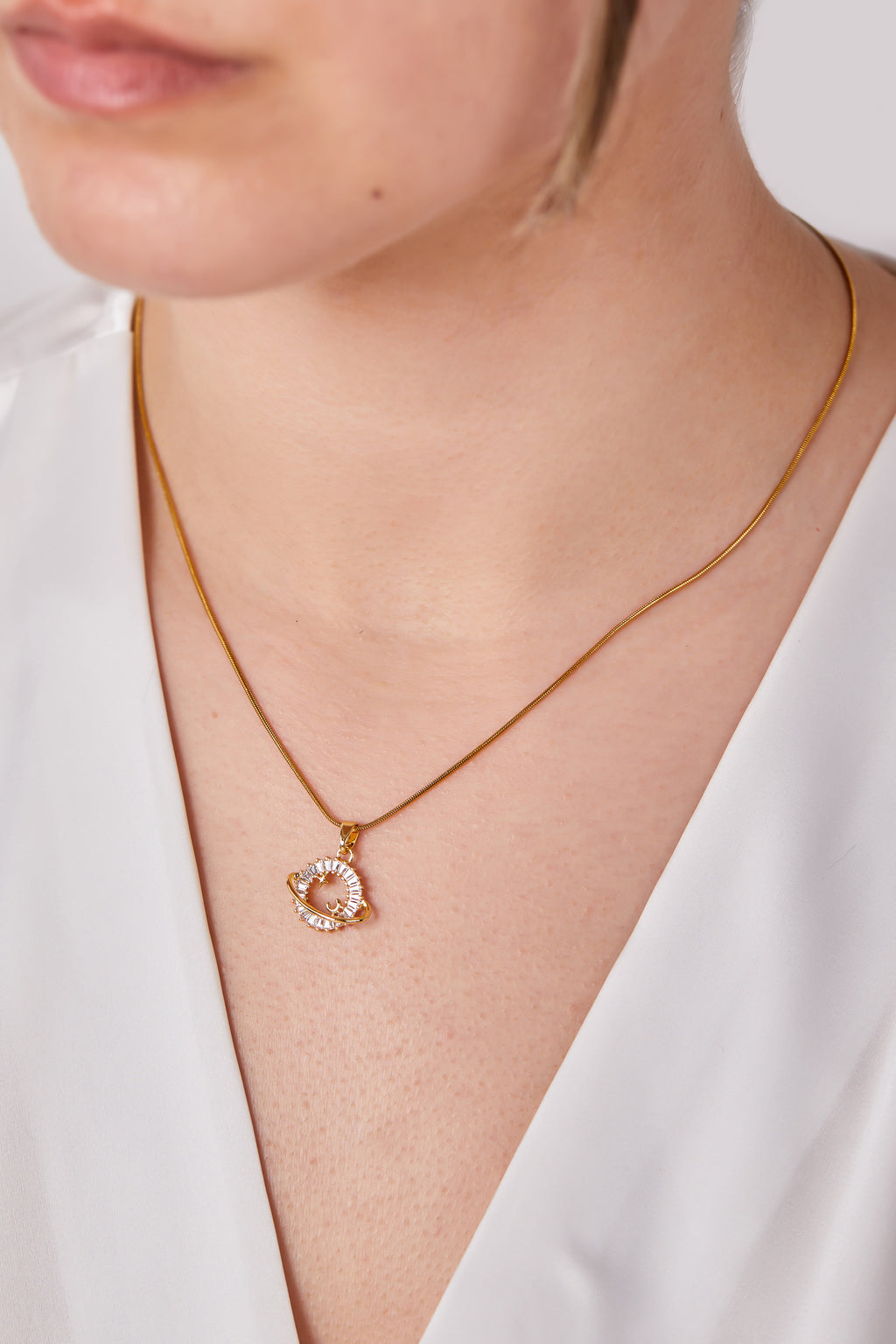 Steel Saturn Necklace Gold